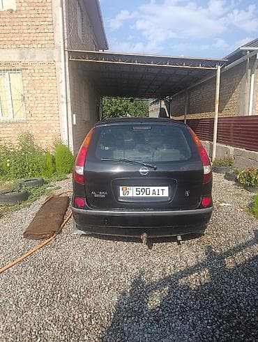 салон машина: Nissan Almera Tino: 2003 г., 1.8 л, Механика, Бензин, Хэтчбэк — 7