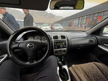 Водный транспорт: Mazda 323: 2002 г., 1.6 л, Механика, Бензин, Универсал — 2