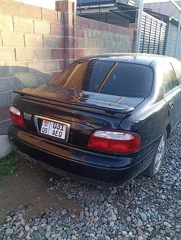 mazda 626 кронос: Mazda 626: 1999 г., 2.5 л, Механика, Бензин, Седан — 2