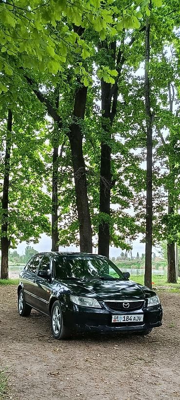 mini ev: Mazda Familia: 2001 г., 2 л, Ручные, Бензин, Хэтчбэк — 5