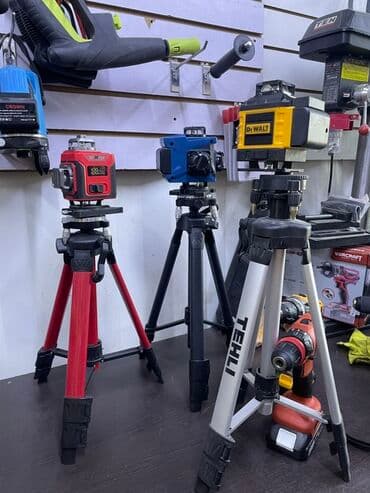 штатив профессиональный: Лазерный уровень DEWALT, установленный на прочный штатив TEHLI — 1