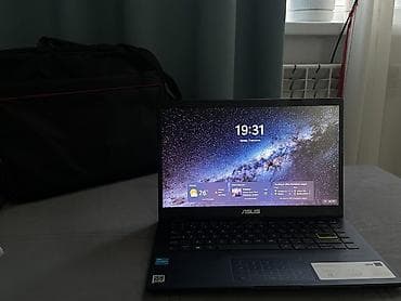 Ноутбук ASUS Vivobook E410KA в тонком компактном корпусе черного