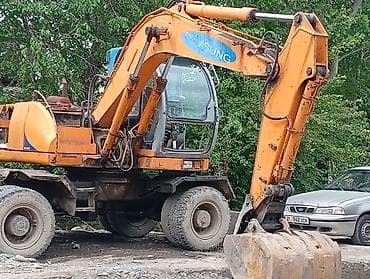 tesla kg: Экскаватор, Samsung, 1998 г., Колесный — 4