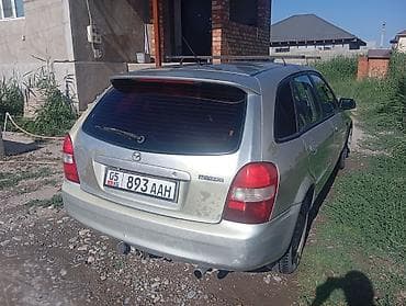 Унаа: Mazda 323: 2000 г., 1.6 л, Кол менен иштөөчү, Бензин, Хетчбек — 5
