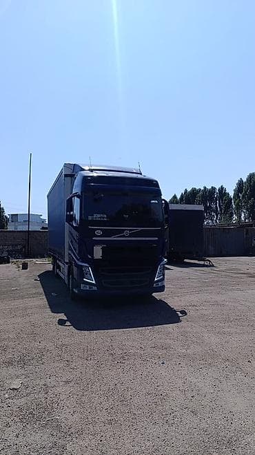 kia carnaval: Грузовой автопоезд Volvo FH с тентованным кузовом (шторка) и прицепом — 6