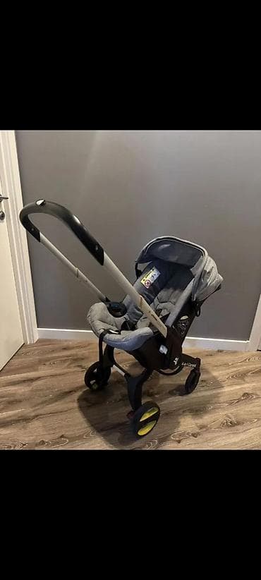 балдар машинасы: Детская коляска‑автолюлька (формат Doona/каркас «коляска‑кресло») — 1