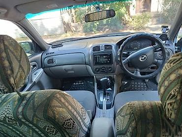 mazda 121: Mazda Familia: 2002 г., 1.5 л, Автомат, Бензин, Универсал — 6
