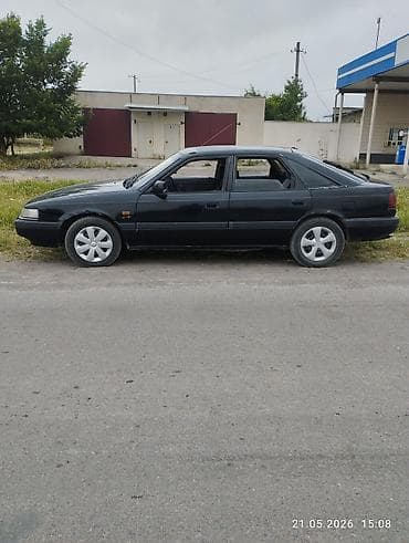 210 cdi: Mazda 626: 1990 г., 2 л, Механика, Бензин, Хэтчбэк — 4