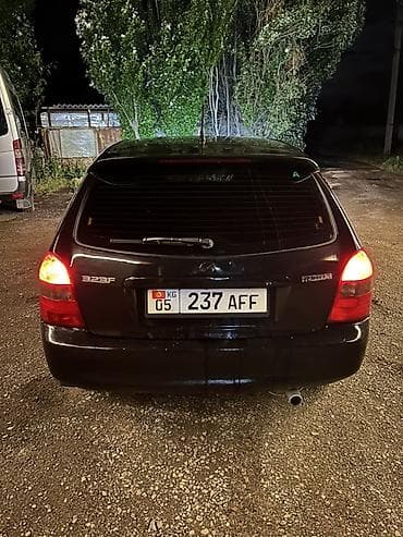 салон жасайбыз: Mazda 323: 2001 г., 1.6 л, Кол менен иштөөчү, Хетчбек — 8