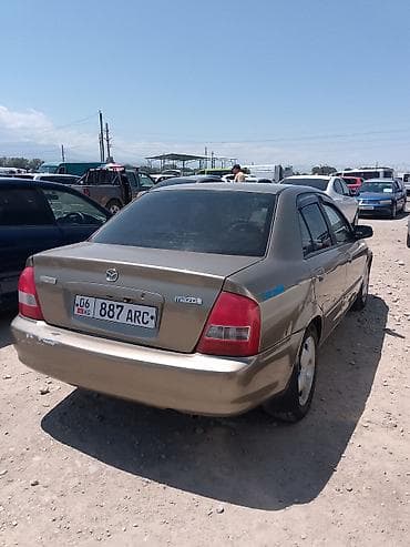 hyundai ionic: Mazda Familia: 1999 г., Автомат, Седан — 4