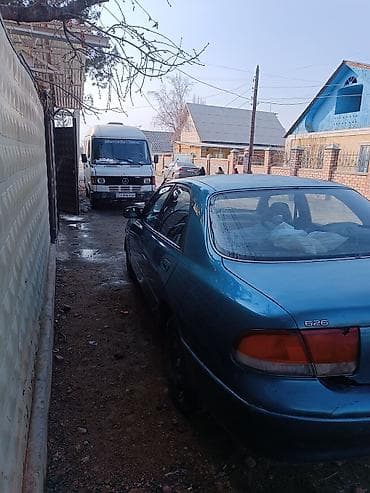 салон на авто: Mazda 626: 1993 г., 1.8 л, Ручные, Бензин, Седан — 3
