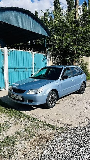 Транспорт: Mazda Familia: 2001 г., 1.5 л, Автомат, Бензин, Универсал — 3