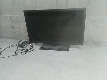 Телевизор Samsung с плоским экраном, диагональ около 24–27". Корпус