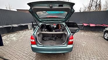 r18 255 55: Mazda 323: 2003 г., 1.6 л, Автомат, Бензин, Универсал — 6