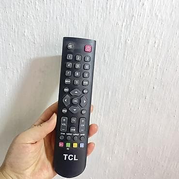 Телевизоры: Телевизор TCL, диагональ около 32–40". Плоская LED‑панель — 5