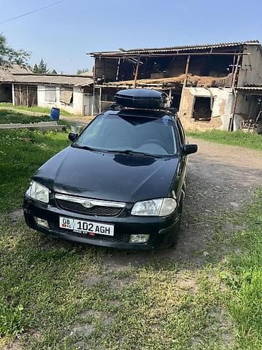 Mazda 323: 1999 г., 1.8 л, Механика, Бензин, Универсал