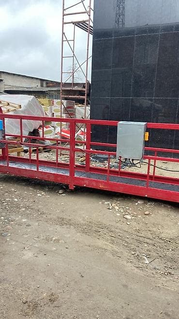 Подвесная фасадная люлька (строительная площадка для высотных работ)