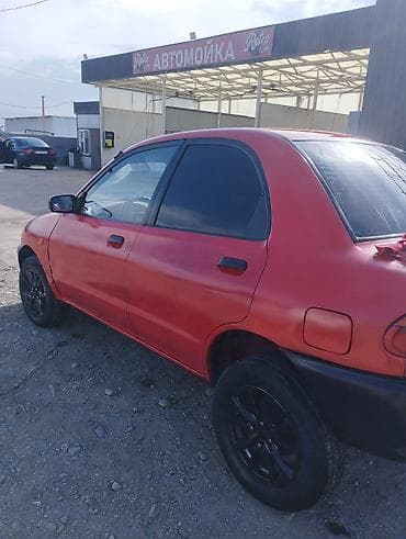 мото скутера: Mazda 121: 1991 г., 1.3 л, Ручные, Бензин, Седан — 2