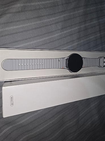 Смарт-часы: Samsung Galaxy Watch 7 44 mm LTE серебристом корпусе и с серым — 6