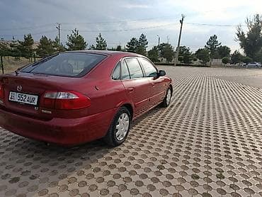 down pipe: Mazda 626: 2000 г., 2 л, Механика, Бензин, Хэтчбэк — 3