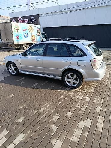 65 style: Mazda Protege: 2003 г., 2 л, Механика, Бензин, Универсал — 5