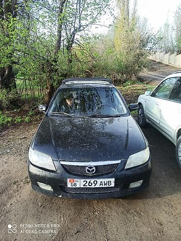 mini jack: Mazda 323: 2003 г., 1.6 л, Механика, Бензин, Универсал — 1