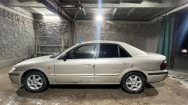глушитель москвич: Mazda 626: 1999 г., 1.8 л, Механика, Газ — 4