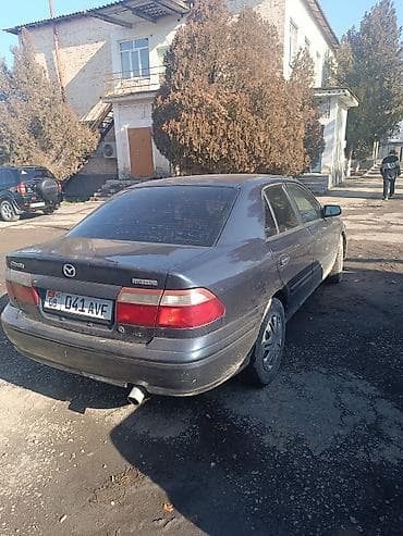 салон машины: Mazda Capella: 1999 г., 1.8 л, Автомат, Бензин, Седан — 8