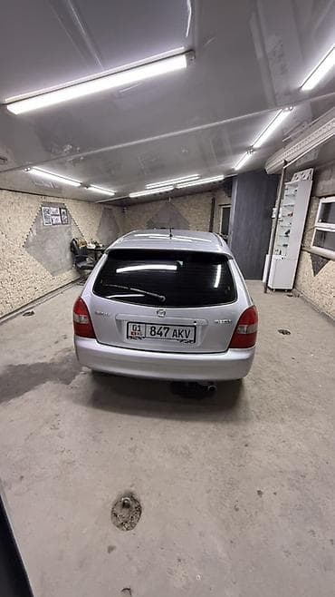 вместе дешевле: Mazda 323: 2001 г., 1.6 л, Механика, Бензин, Универсал — 5