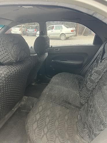 електро машина: Mazda 323: 1995 г., Седан — 4