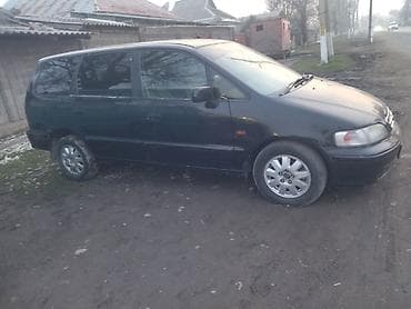 зарядка на авто: Honda Odyssey: 1999 г., 2.3 л, Автомат, Минивэн — 1