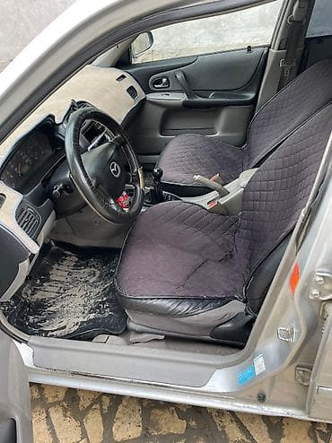 crv 5: Mazda 323: 2003 г., 1.4 л, Механика, Бензин, Седан — 5