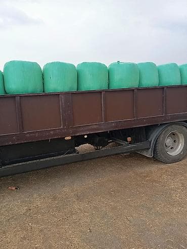 Силос (сенаж) в рулонах в плёнке - Кормовые рулоны цилиндрической