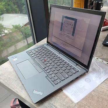 hyper x: Ноутбук Lenovo ThinkPad в корпусе серого цвета, оснащенный процессором — 1