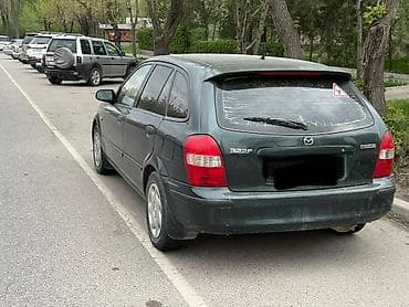 padjero io: Mazda 323: 2000 г., 1.5 л, Автомат, Бензин, Хэтчбэк — 2