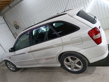 глушитель гольф 2 1.8 бензин: Mazda Familia: 2001 г., 2 л, Автомат, Бензиновая, Универсал — 9