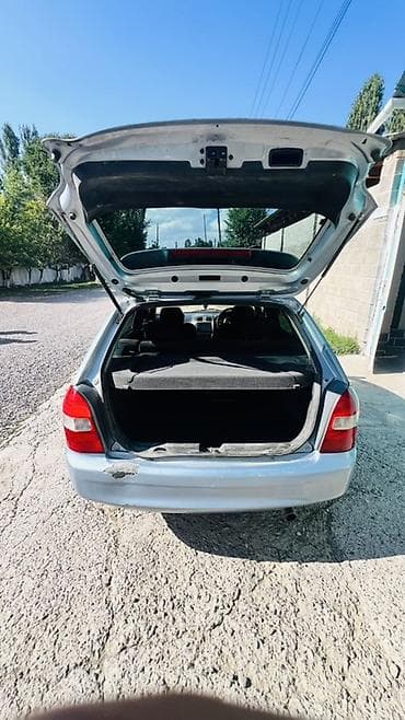Транспорт: Mazda Familia: 2001 г., 1.5 л, Автомат, Бензин, Универсал — 8