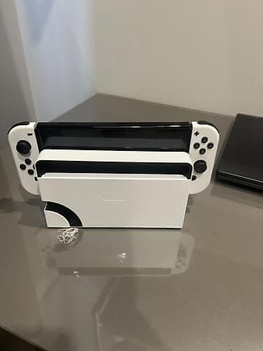 Nintendo Switch OLED: Nintendo Switch OLED (модель HEG-001) — белая версия Комплектация по — 5