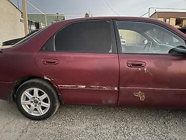 Транспорт: Mazda 626: 1992 г., 2 л, Механика, Бензин, Седан — 5