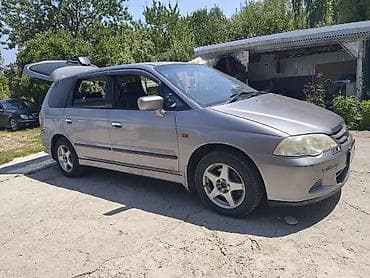 Просторный 7‑местный минивэн/универсал серого цвета. Основные at lalafo.kg Просторный 7‑местный минивэн/универсал серого цвета. Основные
