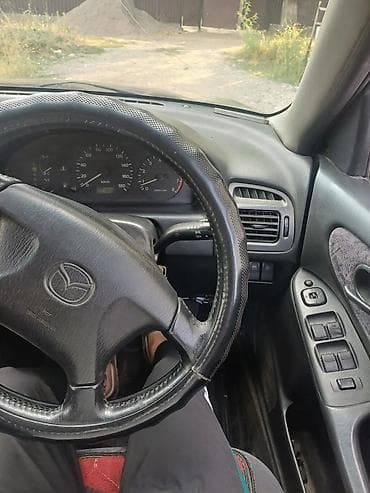 Транспорт: Mazda Capella: 1998 г., 2 л, Автомат, Универсал — 7