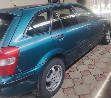 jac 9: Mazda 323: 1998 г., Автомат, Бензин, Хэтчбэк — 1