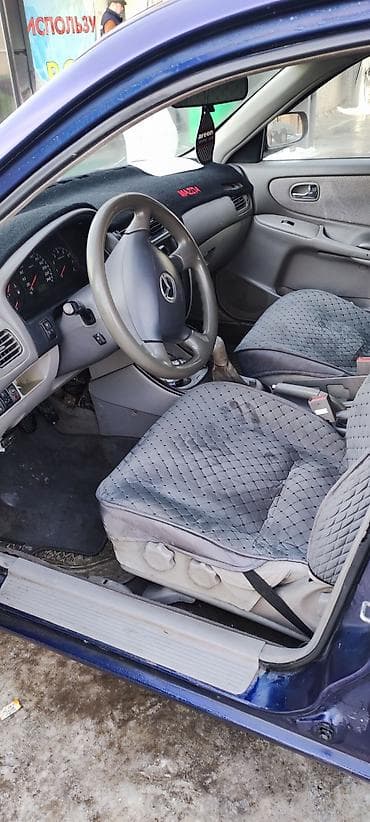 Унаа сатуу: Mazda Capella: 1999 г., 1.8 л, Кол менен иштөөчү, Бензин, Хетчбек — 3