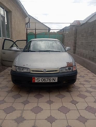 wuling mini ev: Mazda Cronos: 1993 г., 2 л, Механика, Бензин, Хэтчбэк — 4