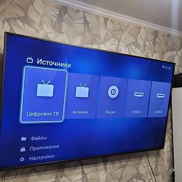 tab a: Телевизор YASIN, диагональ около 55–65" (тонкие рамки, настенное — 1
