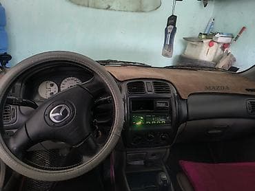 авто сокулук: Mazda 323: 2003 г., 1.6 л, Кол менен иштөөчү, Бензин, Хетчбек — 5
