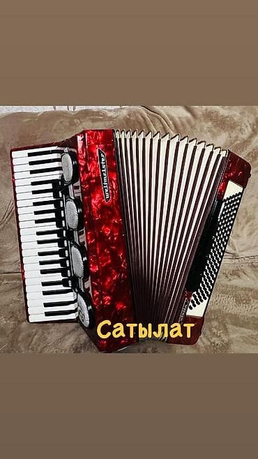 Аккордеон Weltmeister (кнопочно-клавишный), красный перламутровый