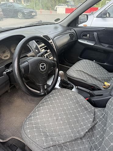 mazda f323: Mazda Familia: 2002 г., 1.5 л, Механика, Бензин, Универсал — 6