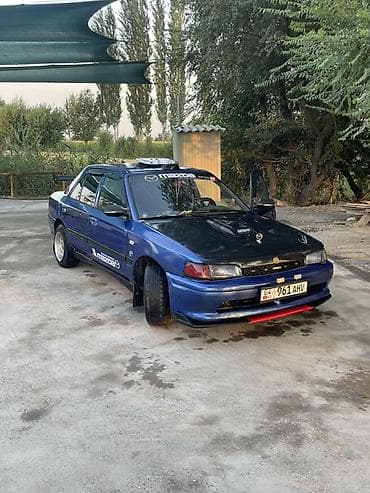 дамкрат авто: Mazda 323: 1992 г., Седан — 1