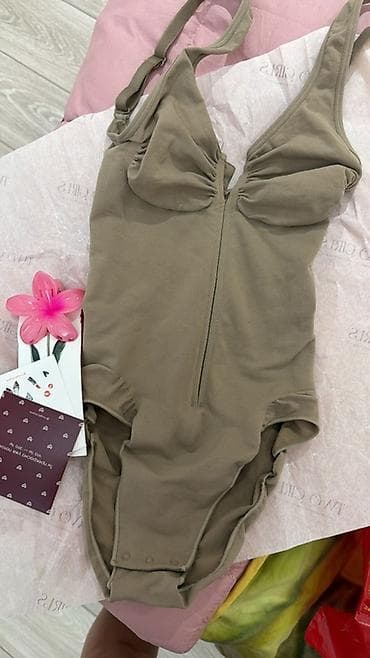 Слитный женский утягивающий skim однотонный,).новый Особенности: -